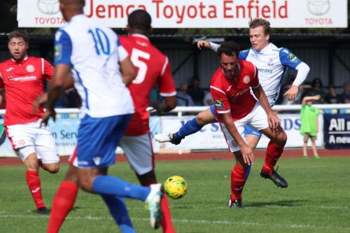 Enfields Mickey Parcell (white, R) sees his shot blocked