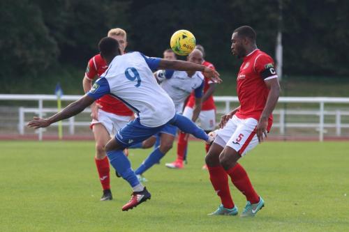 Enfields Ryan Blake (9) and Harlows Stanley Muguo