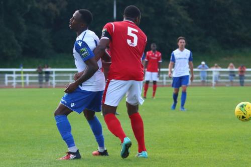 Enfields Ryan Blake (L) and Harlows Stanley Muguo