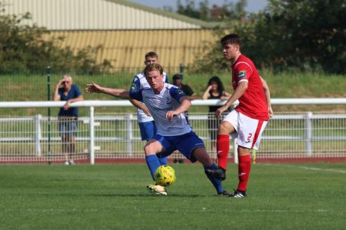Harlows James Shepherd (red) and Enfields Aaron Greene