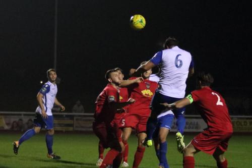 Enfields Adam Martin (6) wins a header