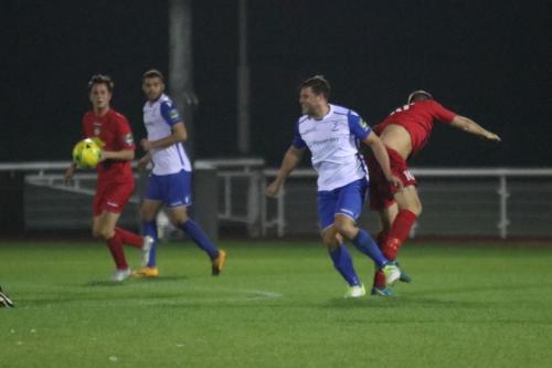 Enfields Adam Martin (white, R) challenges Tommy Wade