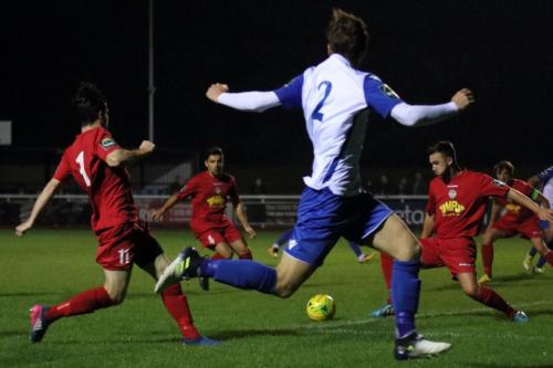 Enfields Mickey Parcell (2) cuts the ball back but only finds red shirts