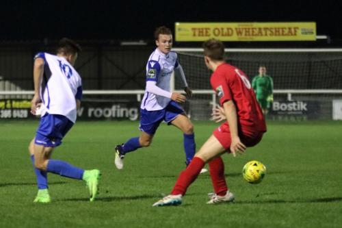 Enfields Mickey Parcell (centre) runs at Daniel Palmer