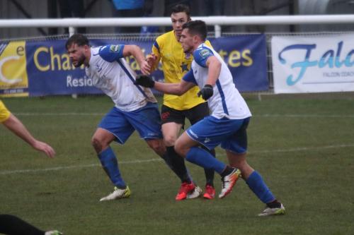 Enfields Adam Martin (L) and Samir Bihmoutine and Kingstonians Greg Cundle
