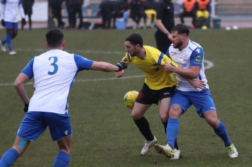 Enfields Adam Martin (R) and Samir Bihmoutine and Kingstonians Michael West