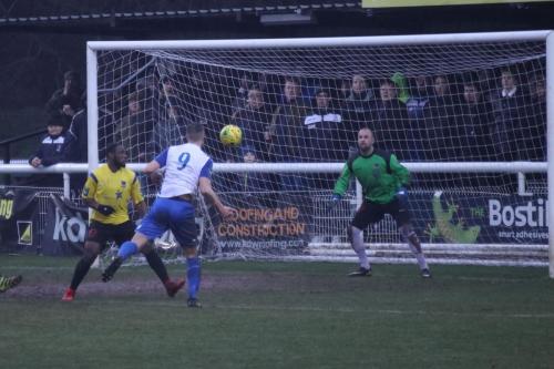 Enfields Brad Wadkins (9) sees his header saved by Rob Tolfrey
