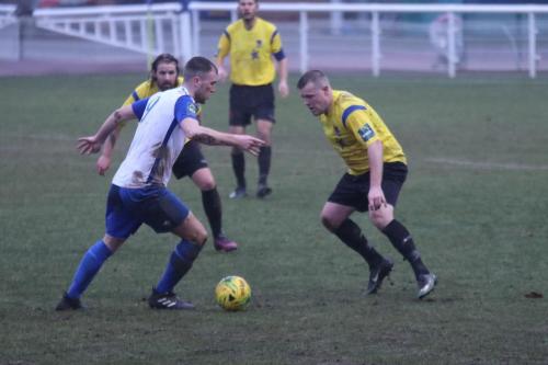 Enfields Brad Wadkins and Kingstonians Nic Ciardini (R) and Tom Beere