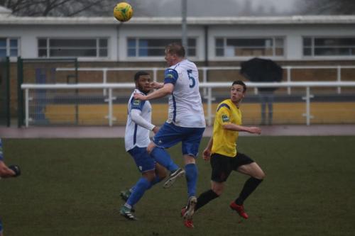 Enfields Mark Kirby (5) and Taofiq Olomowewe and Kingstonians Greg Cundle