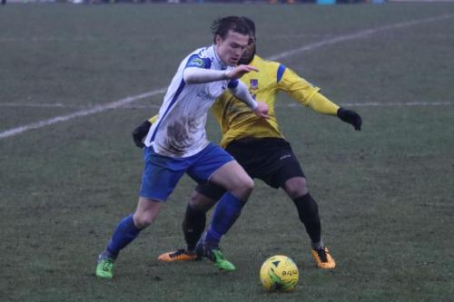 Enfields Mickey Parcell (L) and Kingstonians Andre McCollin