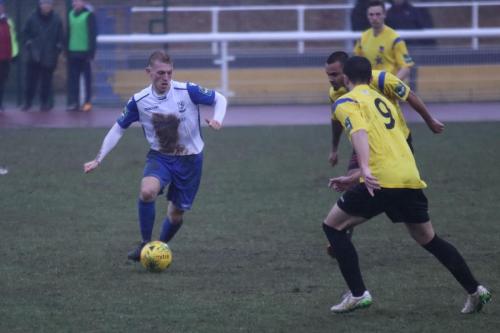 Enfields Ryan Blackman and Kingstonians Michael West (9) and Connor Hunte