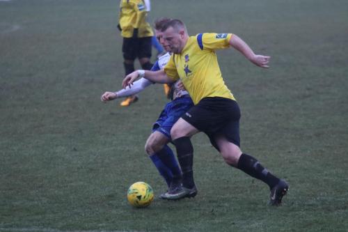 Enfields Ryan Blackman challenges Nic Ciardini (yellow)