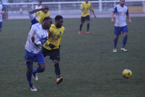 Enfields Ryan Blake (L) and Kingstonians Andre McCollin