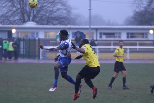 Enfields Ryan Blake (L) and Kingstonians Andrew Musungu