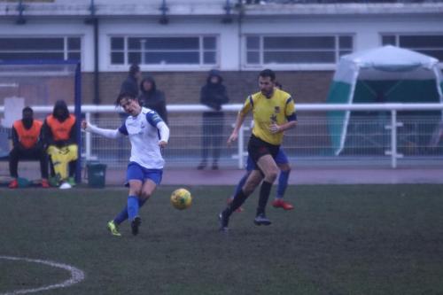 Enfields Sam Youngs (L) and Kingstonian captain Mark Phillips