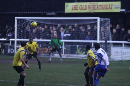 Enfields Sam Youngs (R) tries to curl in a shot