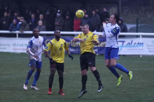 Enfields Sam Youngs (R) wins a header against Nic Ciardini