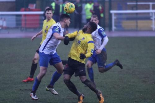 Enfields Samir Bihmoutine (L) and Kingstonians Andre McCollin