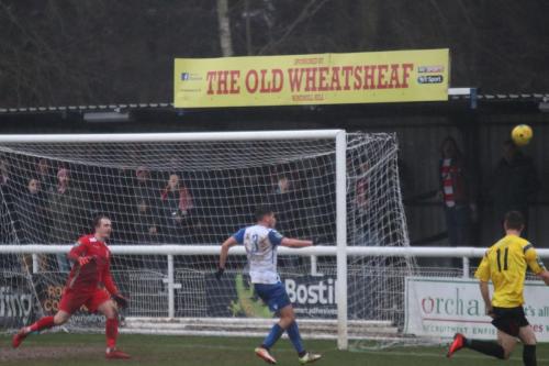 Enfields Samir Bihmoutine (white) clears for a corner