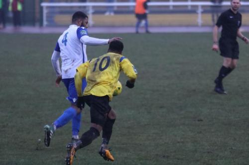 Enfields Taofiq Olomowewe (4) and Kingstonians Andre McCollin