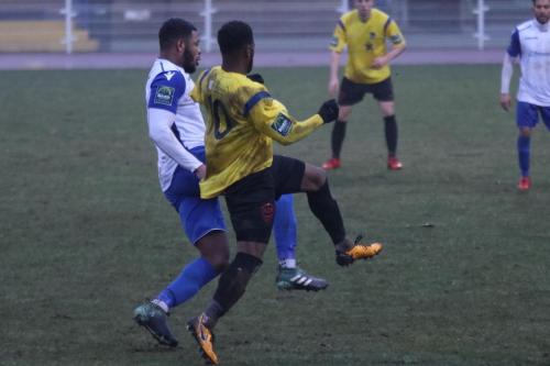 Enfields Taofiq Olomowewe (L) and Kingstonians Andre McCollin44