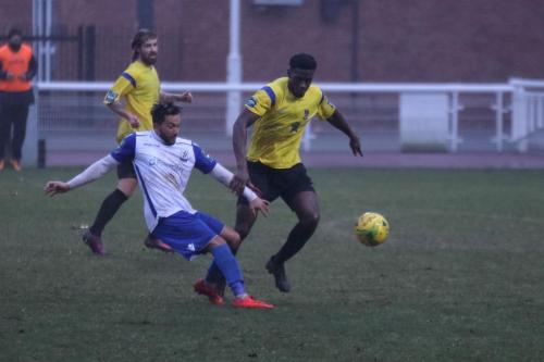Enfields Tyler Campbell (L) and Kingstonians Freddy Yao