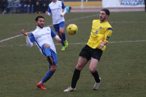 Enfields Tyler Campbell (L) and Kingstonians Michael West