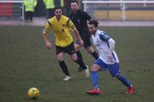 Enfields Tyler Campbell (R) and Kingstonians Michael West