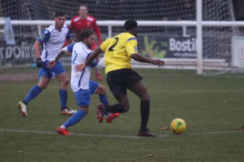 Kingstonians Freddy Yao (2) runs at Tyler Campbell