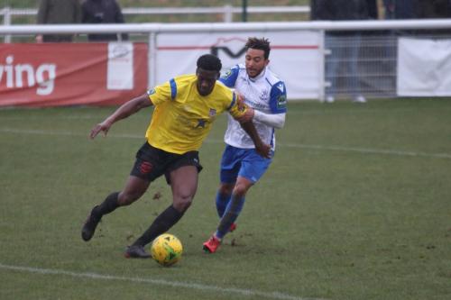 Kingstonians Freddy Yao (L) and Enfields Tyler Campbell