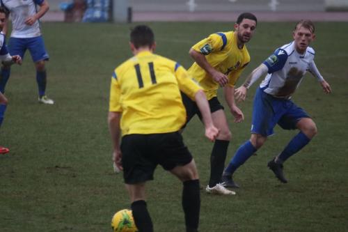 Kingstonians Greg Cundle (11) and Michael West and Enfields Ryan Blackman