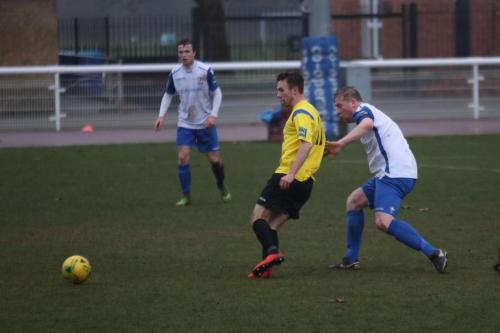 Kingstonians Greg Cundle (yellow) and Enfields Mark Kirby