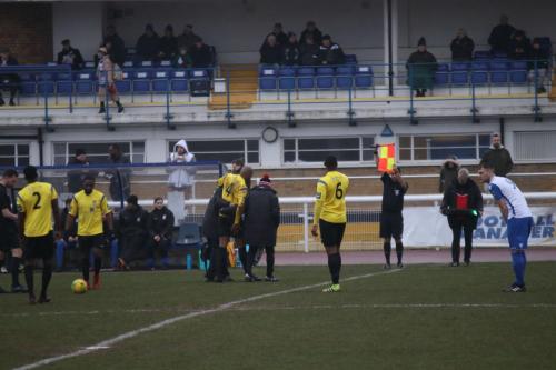 Kingstonians Marvin Eliiott (4) is helped from the field after a first-minute hamstring injury that ended his game