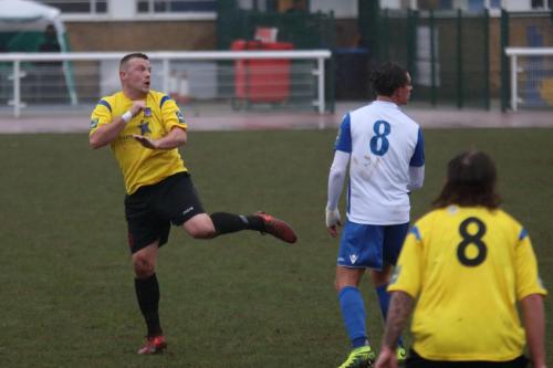 Kingstonians Nic Ciardini (L) and Tom Beere and Enfields Sam Youngs