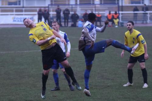 Kingstonians Nic Ciardini (L) challenges Ryan Blake