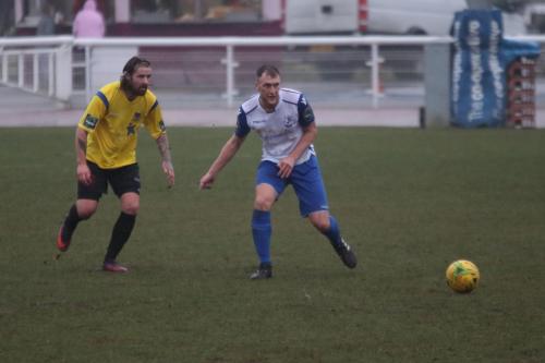 Kingstonians Tom Beere (L) and Enfields Brad Wadkins