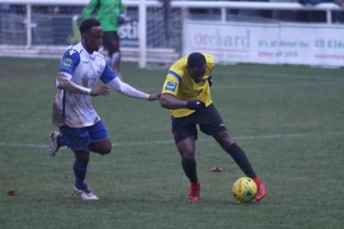 Kingstoninans Andrew Musungu (L) and Enfields Ryan Blake