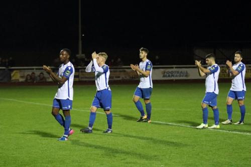 Enfield players salute the supporters