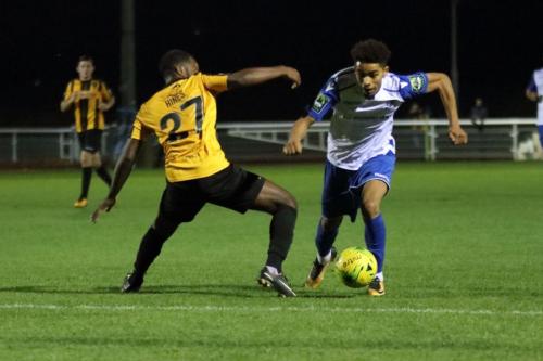 Enfields Montell Moore takes the ball past Zavon Hines