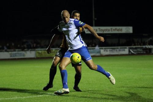 Enfields Simon Thomas shoots despite the attentions of Alex Wynter79