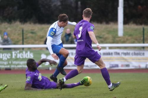 Tootings Quincy Rowe (L) tackles Sam Youngs