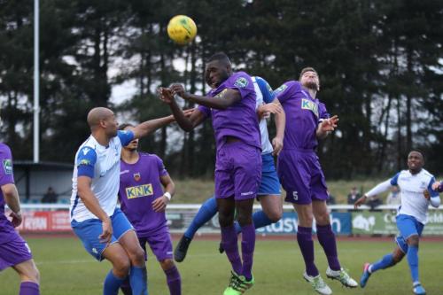 Tootings Quincy Rowe (purple, centre) heads clear