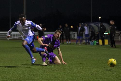 Tootings Sam Flegg (R) tackles Ryan Blake