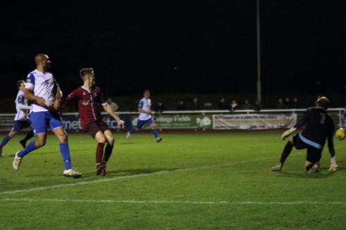 A cross from the Enfield right wing passes harmlessly through the Wingate goal area