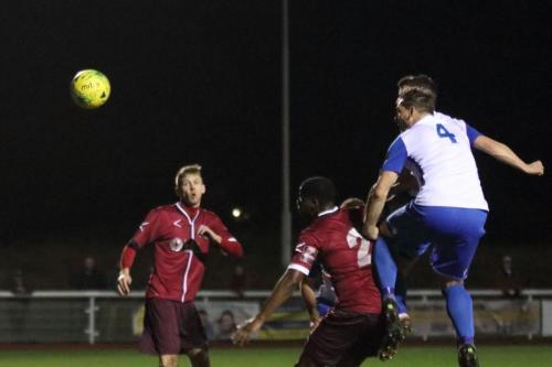 Enfields Darren Purse (4) heads on goal but sees the ball cleared off the line