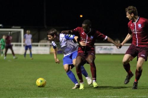 Enfields Elliot Benyon (L) and Wingates Nathan Mavila and Sean Cronin (R)