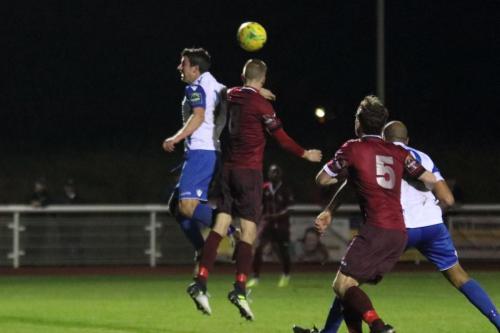 Enfields Elliot Benyon (L) challenges Rob Laney