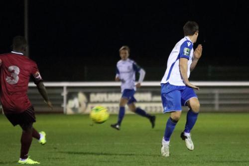 Enfields Elliot Benyon (R) tries to block Nathan Mavilas clearance