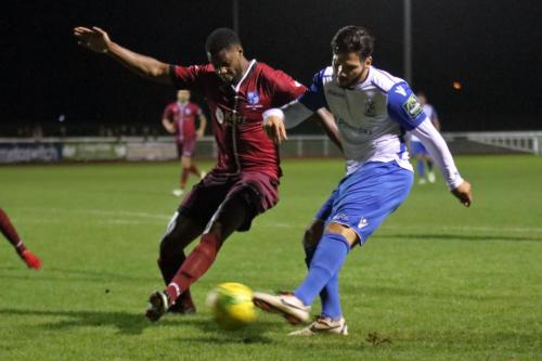 Enfields Mario Noto (R) and Wingates Ola Williams