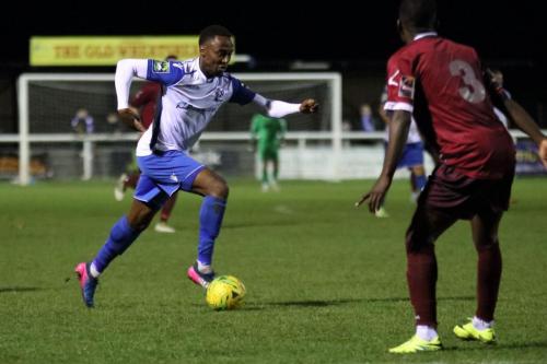 Enfields Ryan Blake (L) runs at Nathan Mavila